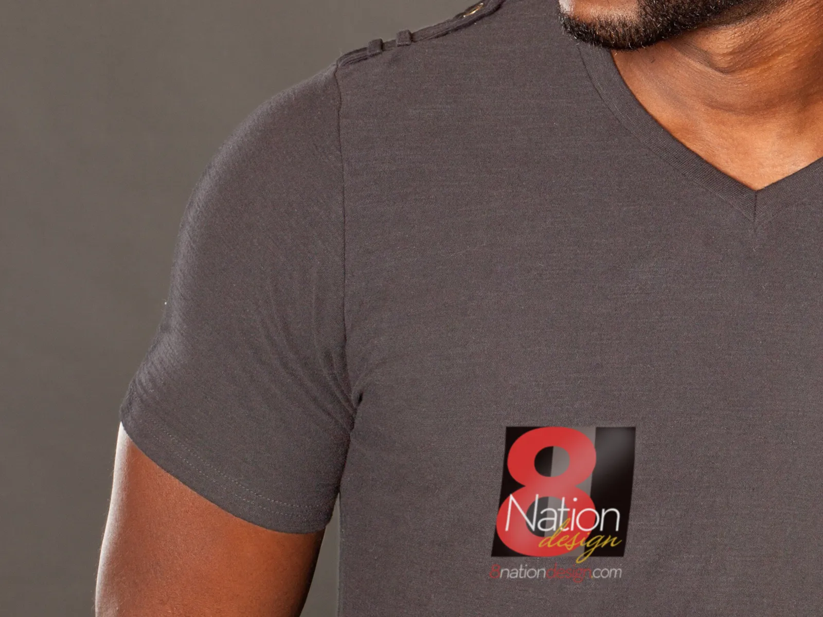 8 Nation logo on a gray V-neck T-shirt